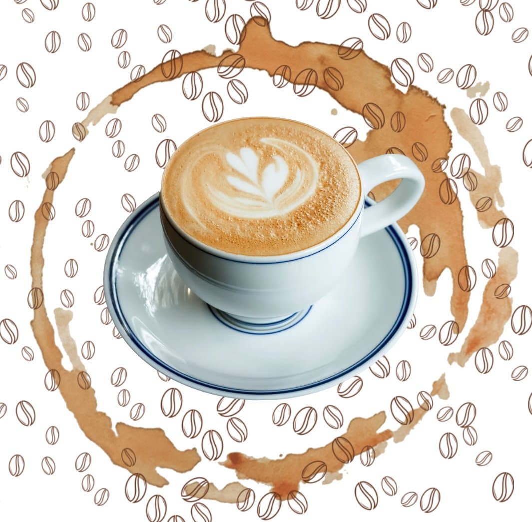 Cappuccino with latte art in a white cup on a saucer